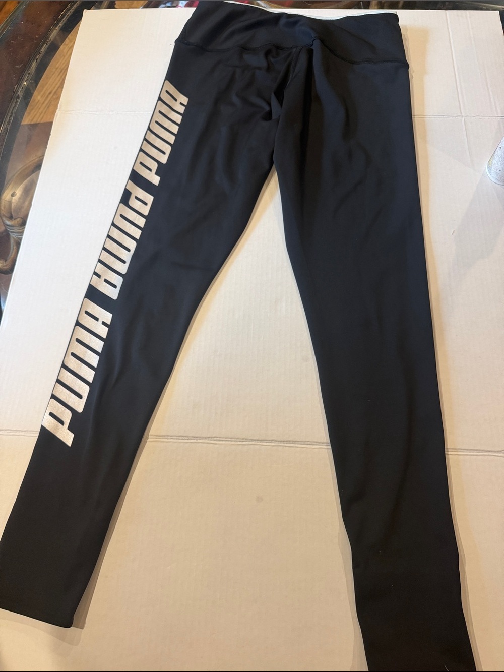 Puma Black Leggings with Metallic Gold Logo Stripe